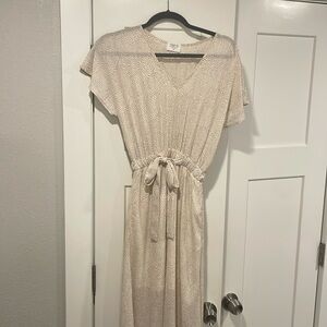 Sienna Sky brand. Color is cream with brown little dots everywhere. The size XS.